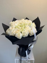 Elegant 'Midnight Desire' bouquet of white Phuket roses wrapped in black and tan paper, perfect for romantic gestures.