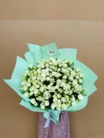 Ever Green bouquet of white spray roses wrapped in mint green paper.