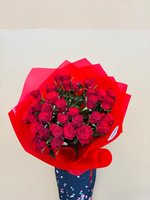 Classic red rose bouquet wrapped in deep red paper.
